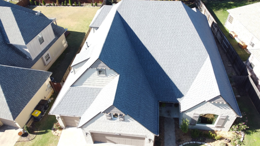 Aerial view of a new light gray shingle roof