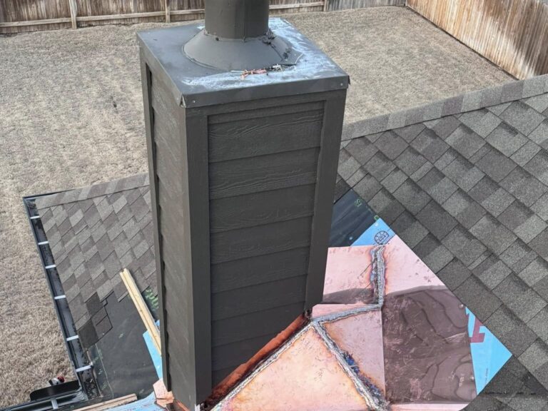 New chimney flashing on an asphalt shingle roof