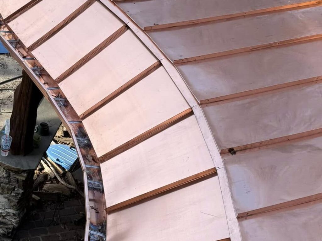 Curved copper roofing detail installed by Family Tree Roofing on a South Tulsa home.